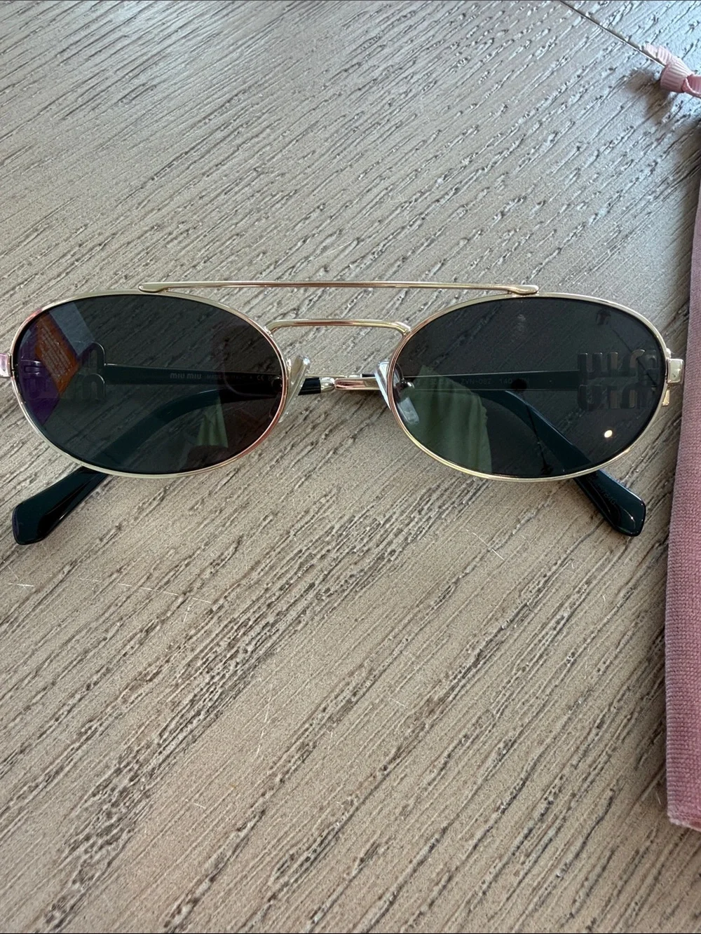 Miu Miu Gold Frame Oval Sunglasses with Dark Lenses and Pink Case/Pouch